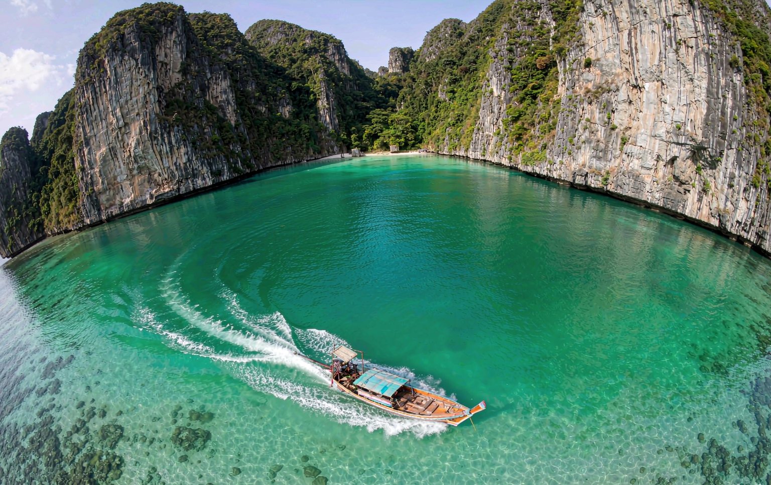 Longtail boat in a turquoise lagoon in southern Thailand
